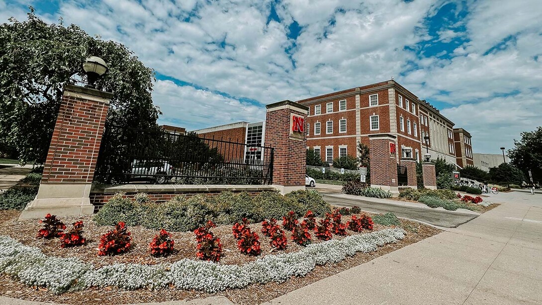 City Campus gateway with Nebraska Union in background and landscaping in foreground