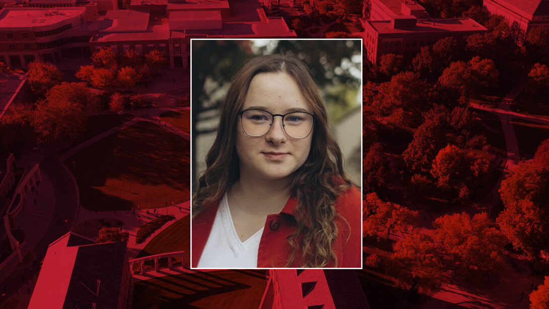 Color portrait of Anna Synya on a red campus background