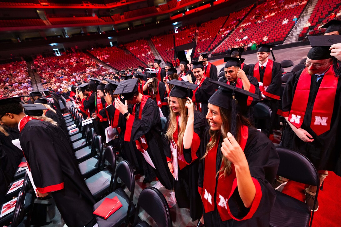 Graduates turn their tassels after receiving their undergraduate degrees.