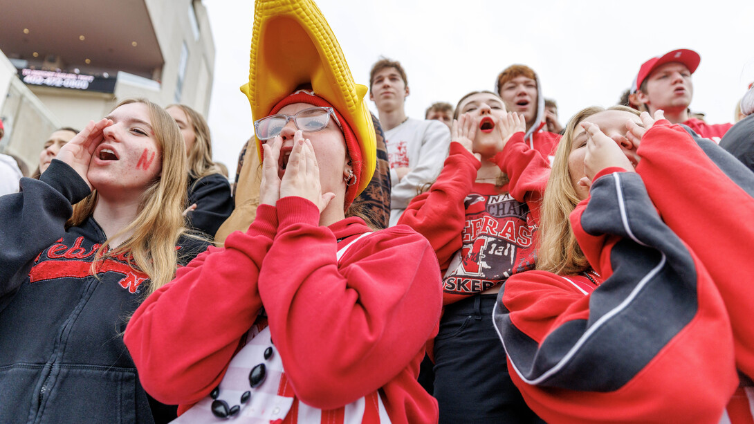 Husker fans (from left) Audrey Hutchinson, Brooklynne Costello and Kailee Eisma cheer during the first quarter of the Nebraska-UCLA game Nov. 2, 2024, at Memorial Stadium.