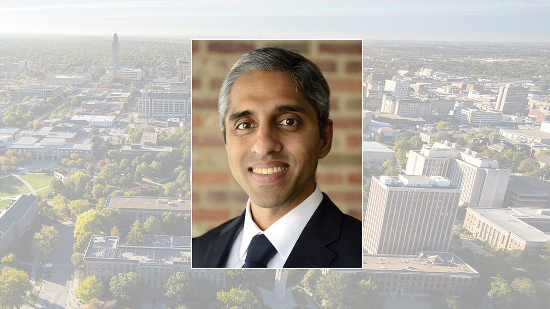 Color portrait of Dr. Vivek Murthy, former U.S. surgeon general, on a color campus background.