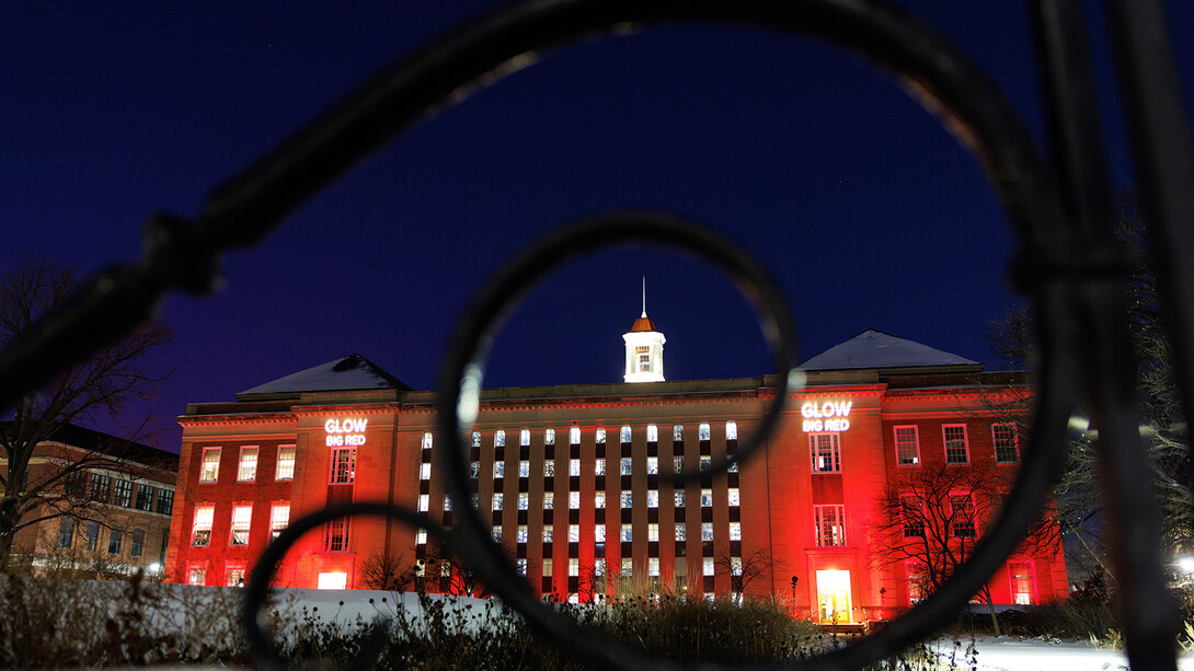 Love Library South is illuminated in red on Feb. 12, 2025, in honor of Glow Big Red — 24 Hours of Husker Giving.