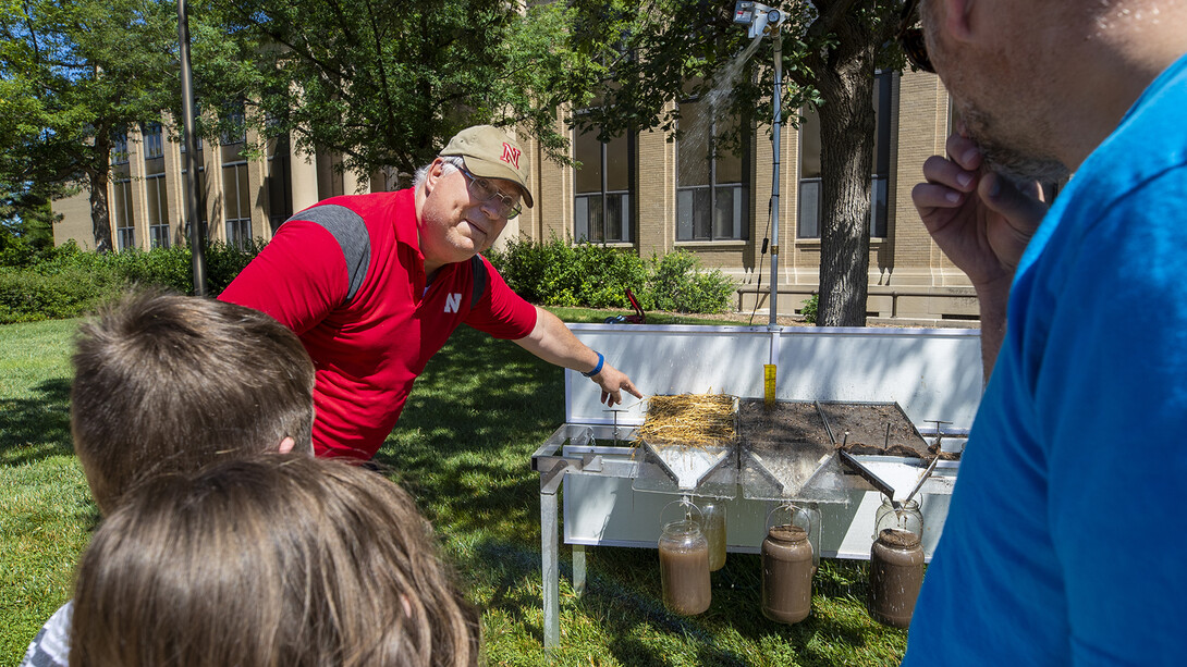 Children and parents listen to a science presentation during East Campus Discovery Days on June 12.