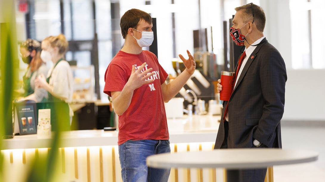 Chancellor Ronnie Green talks with Benjamin Janssen, a junior from Marquette, Nebraska, at the Nebraska East Union Starbucks. Janssen said meeting the Chancellor was on his bucket list for while he is at Nebraska.