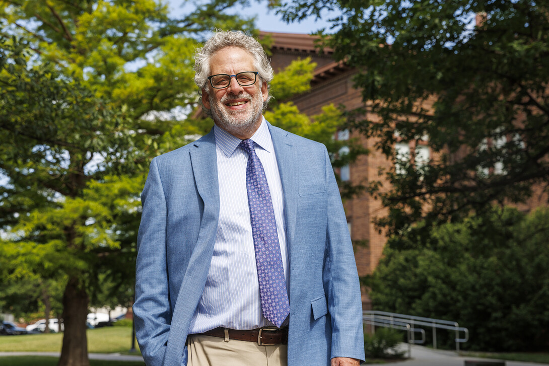 Andy Belser, dean of the Hixson-Lied College of Performing Arts, is photographed outdoors.