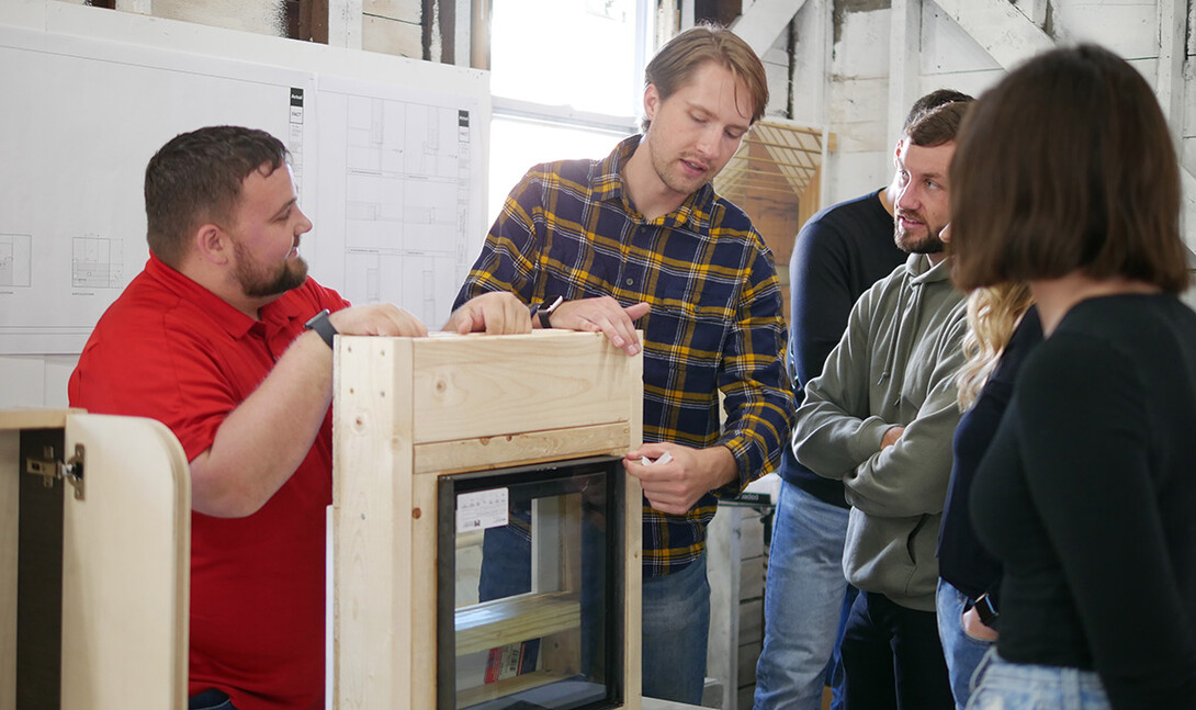 At a public, exhibition held at the Art Chapel,  architecture students Tanner Koeppe, Andrew Winter, Nick Olsen and Ashley Hillhouse share with local residents the finer details of their minimal custom window frames.