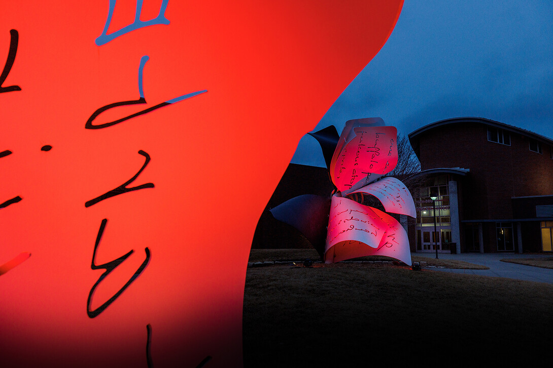 The "Torn Notebook" sculpture on the corner of 12th and Q streets reflects Husker pride on Feb. 15.