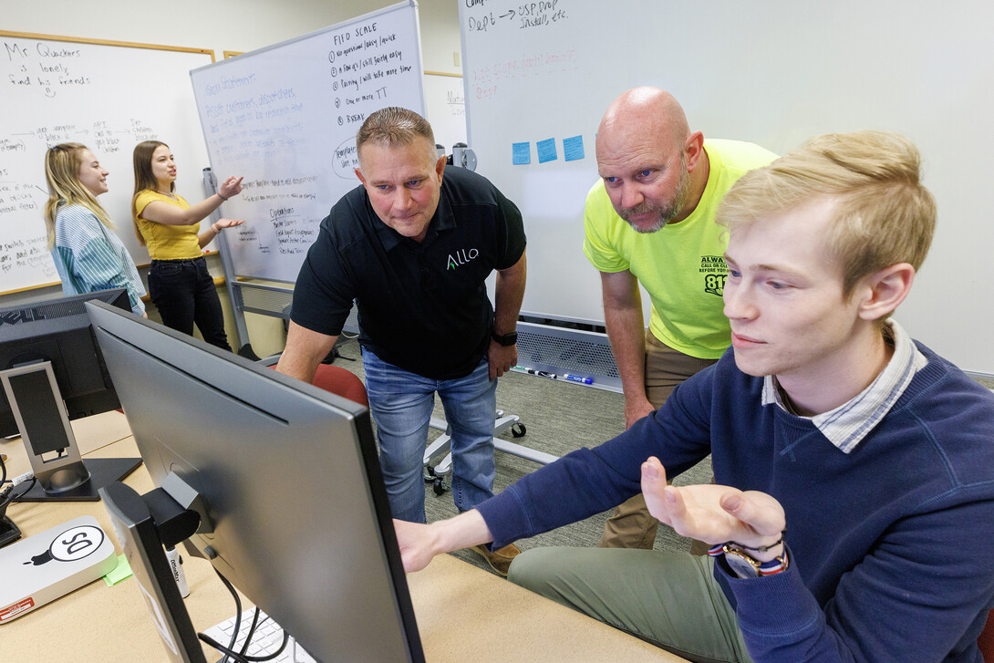 Erik Konnath, right, talks with members of the Allo team, Ed Jarrett and Jon McHenry (in yellow t-shirt) as they discuss the project.  In the background from left are Design Studio team members Sophie Hill and Hannah Pokharel. May 2, 2023. 