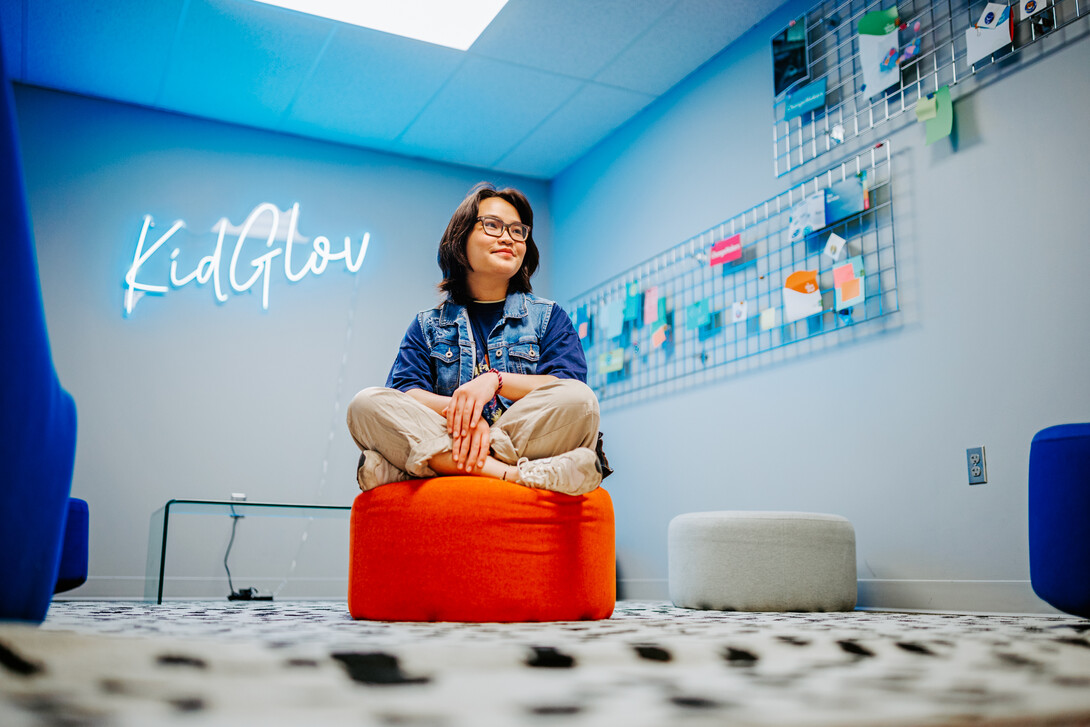 Mai Vu poses for a photo in the College of Journalism and Mass Communications' Experience Lab