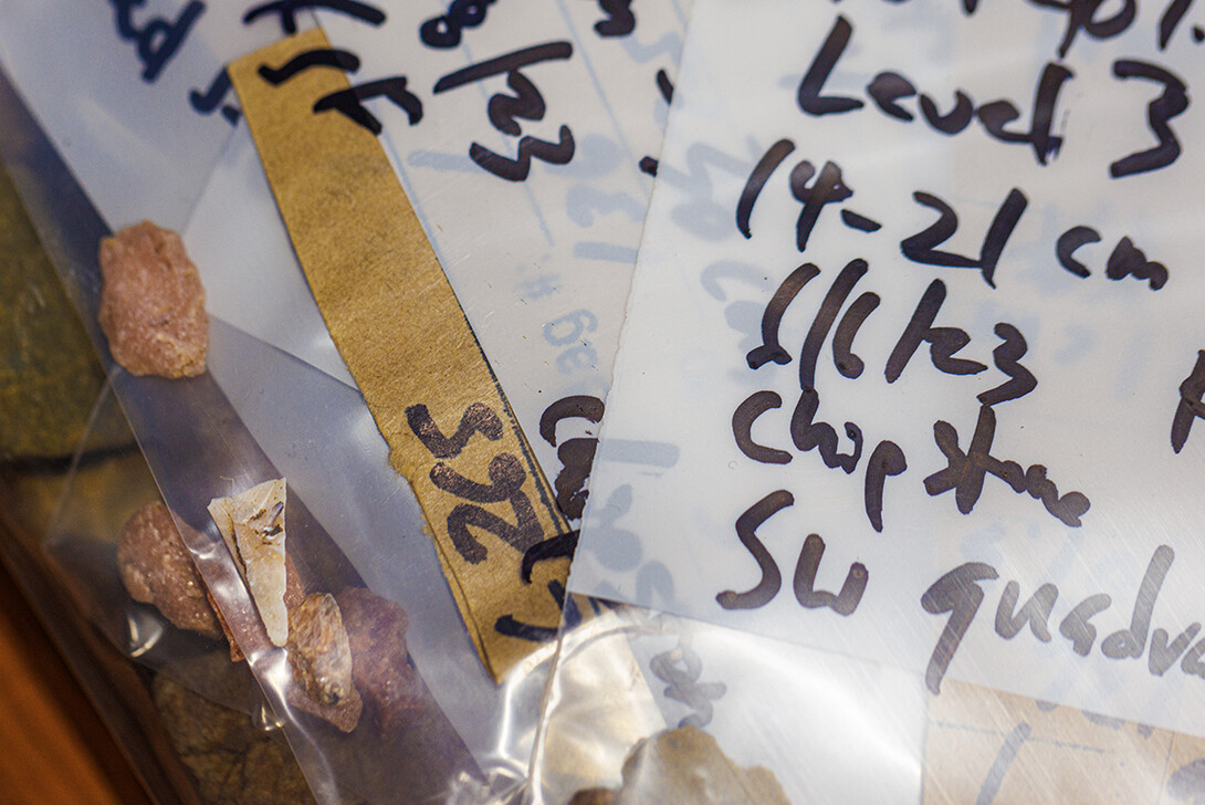 Shards recovered from the dig site are bagged and tagged in the lab area.
