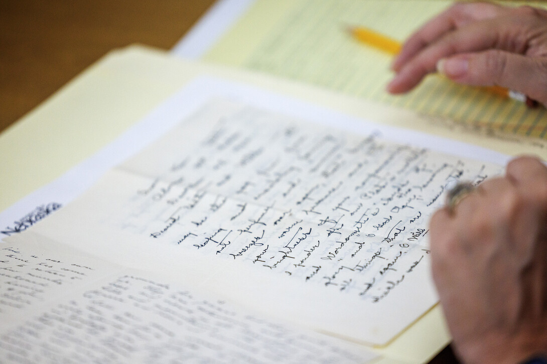  Maria Kane, a scholar from St. Louis, carefully reads one of the letters on file in the special collections archive. Willa Cather scholars from around the world are in Nebraska this month for Willa Cather: Place and Archive. 