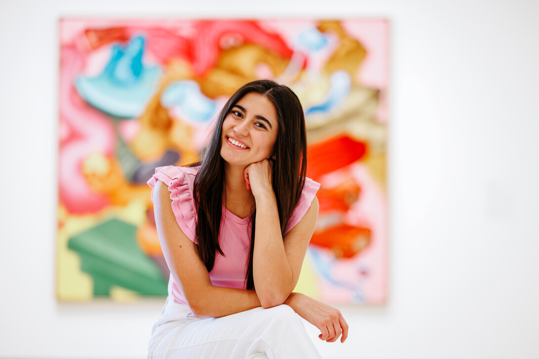 Valeria Uribe smiles for a photo in the Sheldon Museum of Art