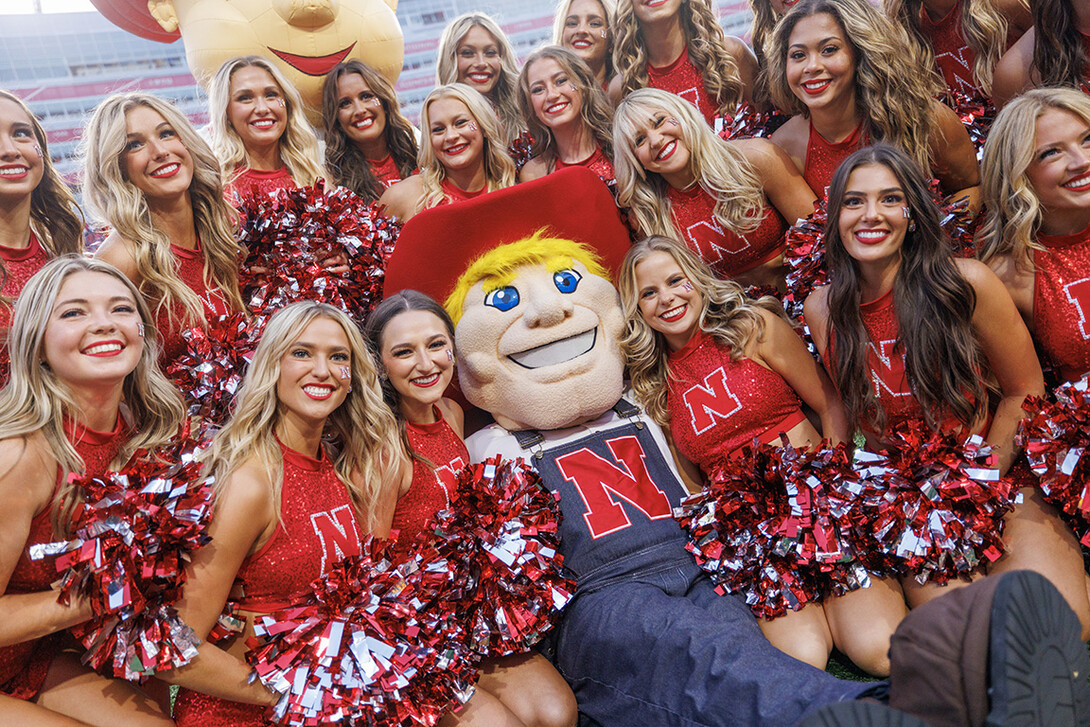 Herbie poses with the Cheer Squad during the home opener for the Husker football team.
