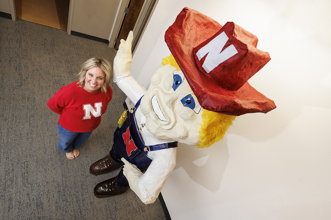 Ashley Dohe, administrative coordinator for Electrical & Computer Engineering, has make an 8-foot tall Herbie Husker from paper mache.  She hopes to auction it off to help veterans.