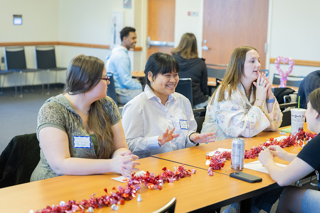 Susie Welker (left) and Lay Wah (center) chat during the Study Abroad Speed Dating Feb. 13.