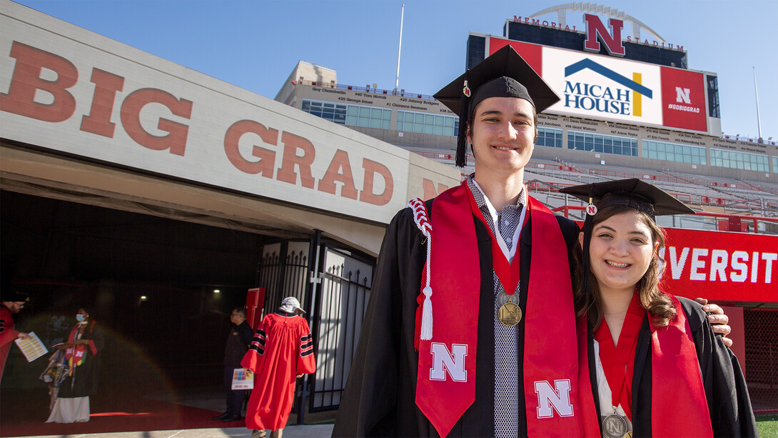 Max Radlicz and Trinity Mozingo standing side-by-side in Memorial Stadium prior to commencement on May 18.