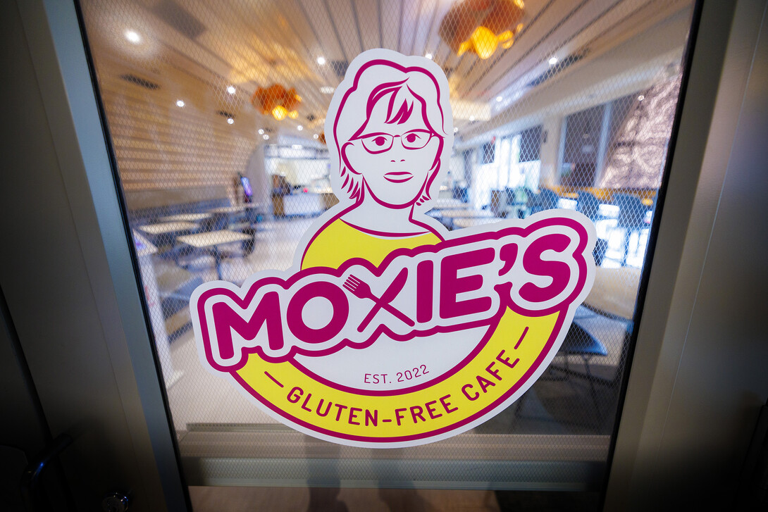 The sign outside Moxie's welcomes visitors into the cafe.