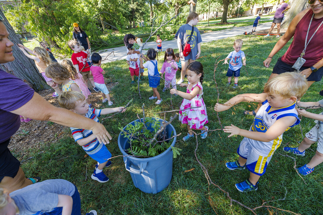 Children in the Ruth Staples Laboratory turned their daily walk into a service project as they helped collect sticks that fell during Wednesday evening’s storm.