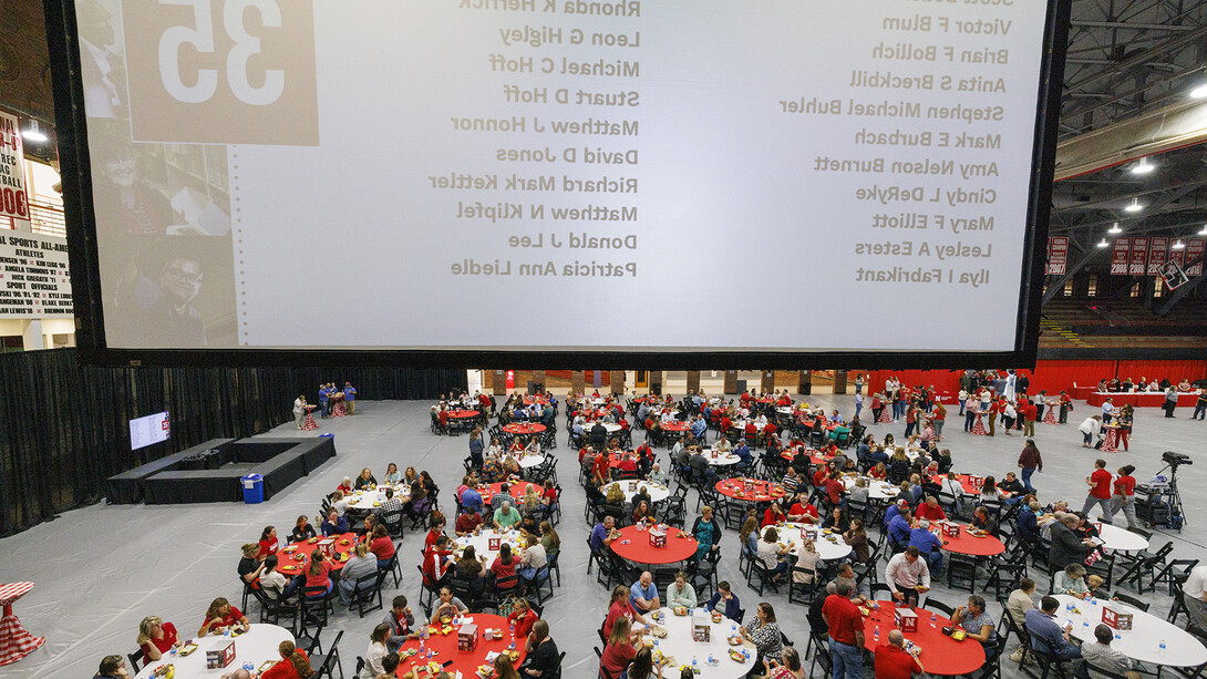 Hundreds of faculty and staff sit at round tables in the Coliseum during the Celebration of Service on Sept. 6.