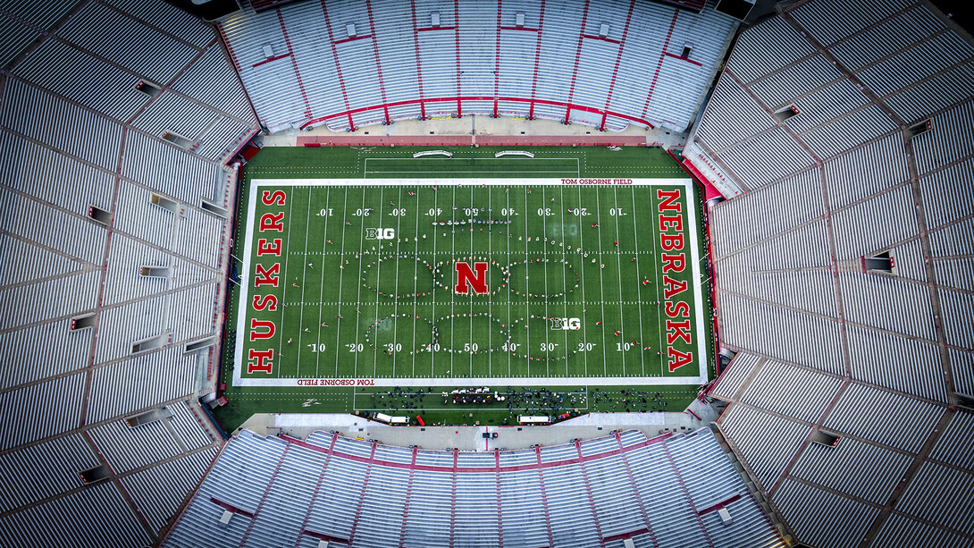 The Cornhusker Marching Band forms rings as it performs “Band On The Run” by Wings (Paul McCartney) during practice in Memorial Stadium.