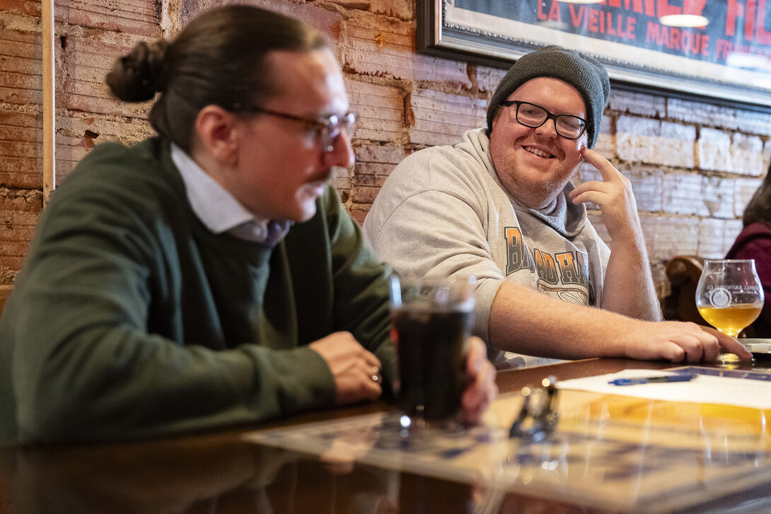 Graduate student Aedan Helweg, right, speaks to professor Jeffrey Jarzomb in German at Yia Yia’s on O Street.