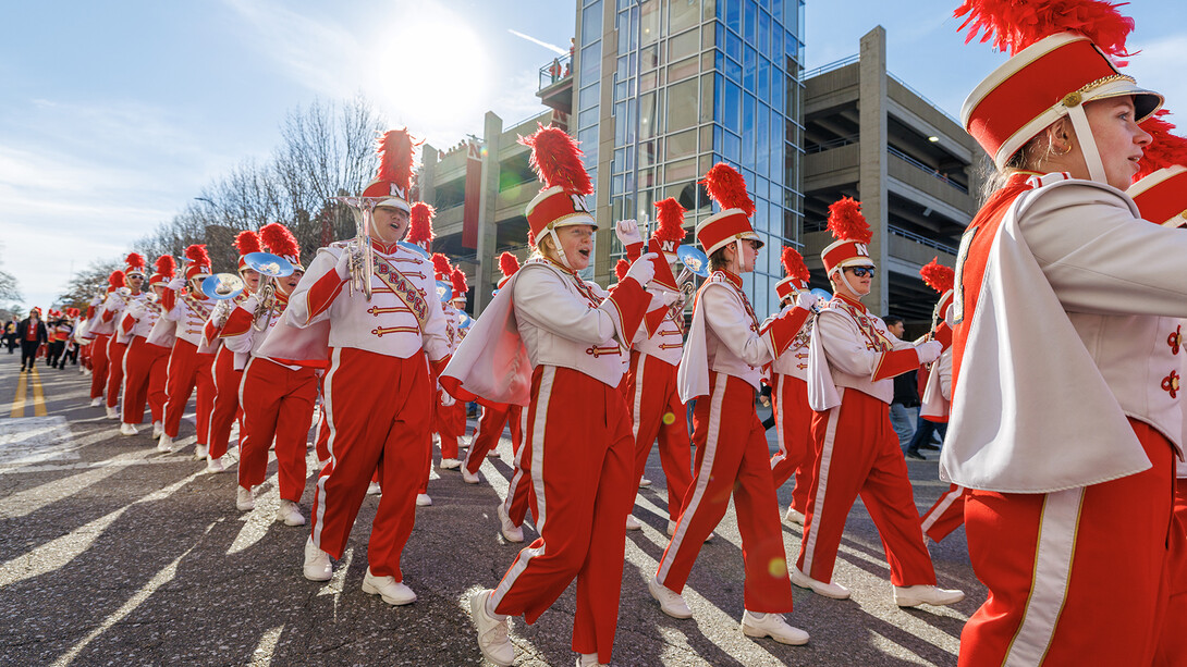 The Cornhusker Marching Band marches along Stadium Drive on the way to Memorial Stadium for the Nov. 23 Husker football game with Wisconsin.