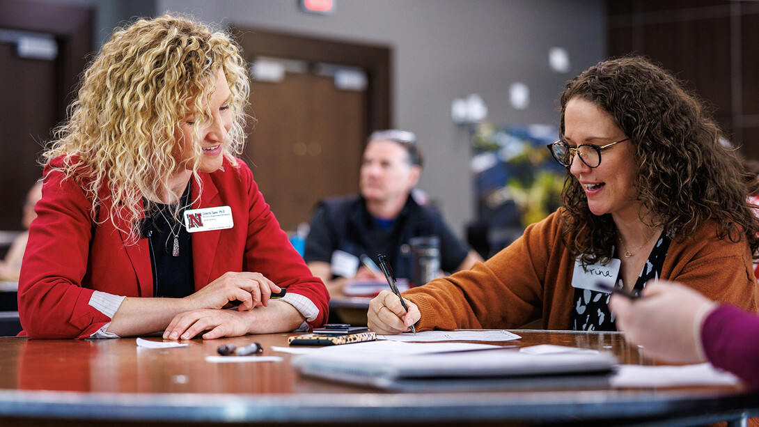 Celeste Spier, director of Organizational Development and Training in Human Resources, engages with Trina Cress, a career coach for the College of Arts and Sciences, during an NRICH: Strategies for Effective Presentations session April 23 in the Nebraska Union. 