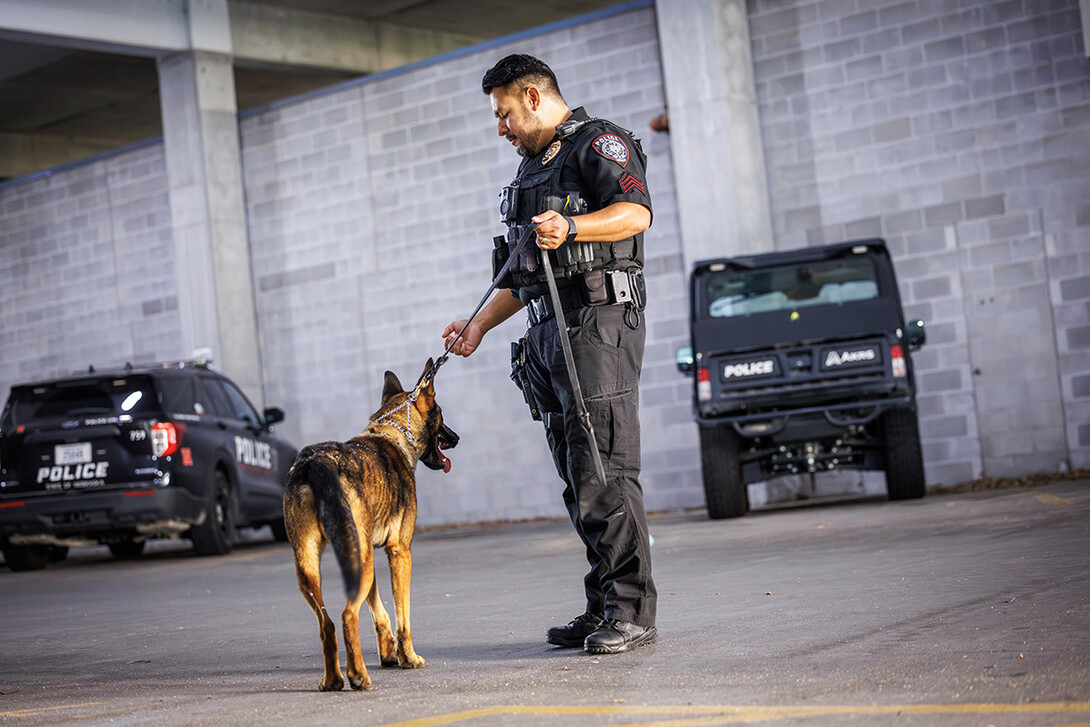 Delgado gives Dodger a command during a training exercise.