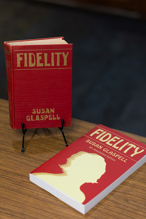 Two editions of "Fidelity," by Susan Glaspell, sit on a table in Bailey Library. The edition on the left is from 1915, and on the right is a newly published edition.