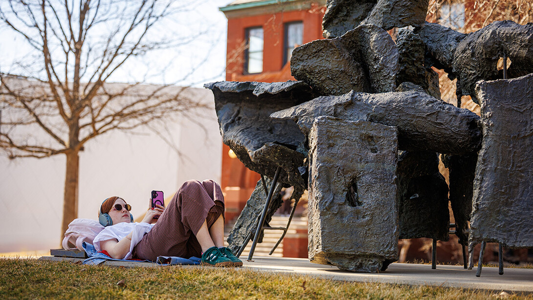 Lillian Bittle, a freshman Journalism major, studies art history while relaxing under the “Birth of Venus” sculpture on a warm February day.