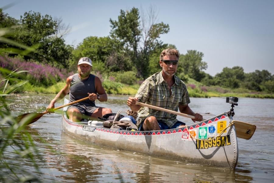 Mike Forsberg and Pete Stegen canoe down the Platte River during filming of the "Follow the Water" documentary.