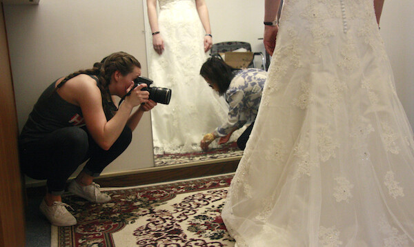Alanna Johnson photographs May Nguyen as she works on a customer's wedding dress in her shop, May's Alterations. The photos were for the Nebraska Mosaic project.