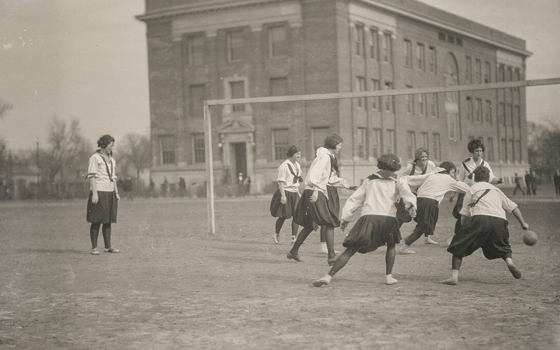 Female students at the University of Nebraska play soccer in 1924 on the lawn where Love Library now sits.