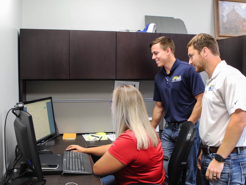 Bennett Perlinger (center) engages with his co-workers.