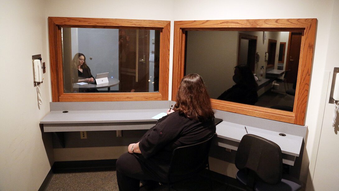 Deb Hope (center), Aaron Douglas professor of psychology and faculty clinic supervisor, watches Brenna Lash, a graduate student, from an observation room at the Psychological Counseling Center.