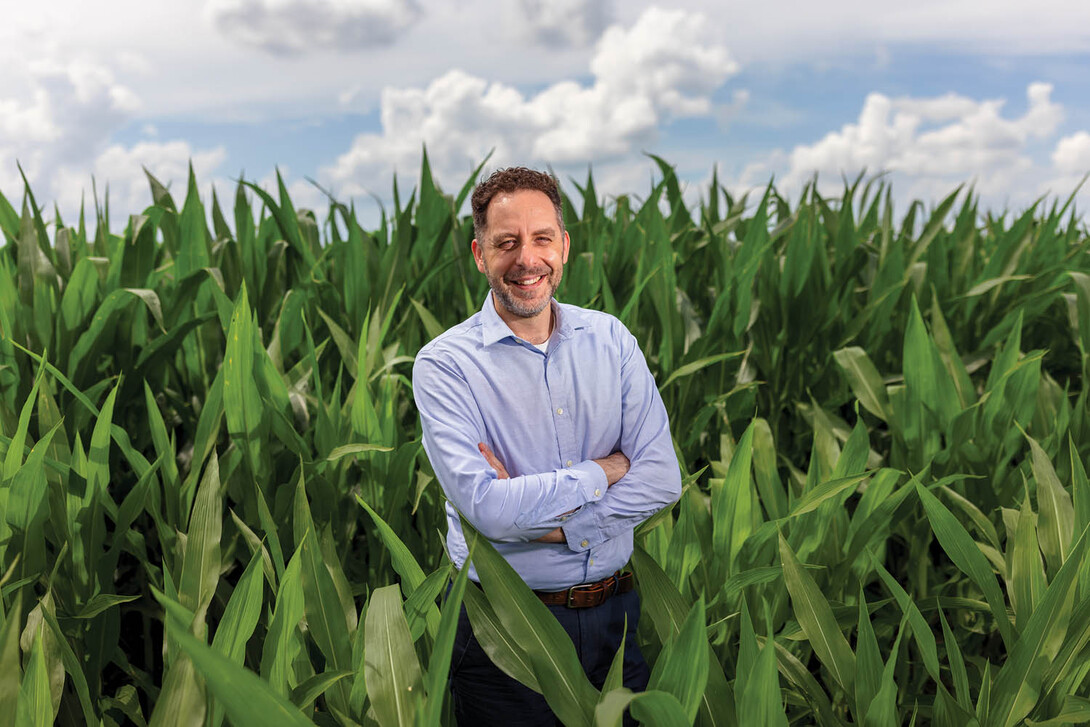 Nick Brozović standing in a cornfield