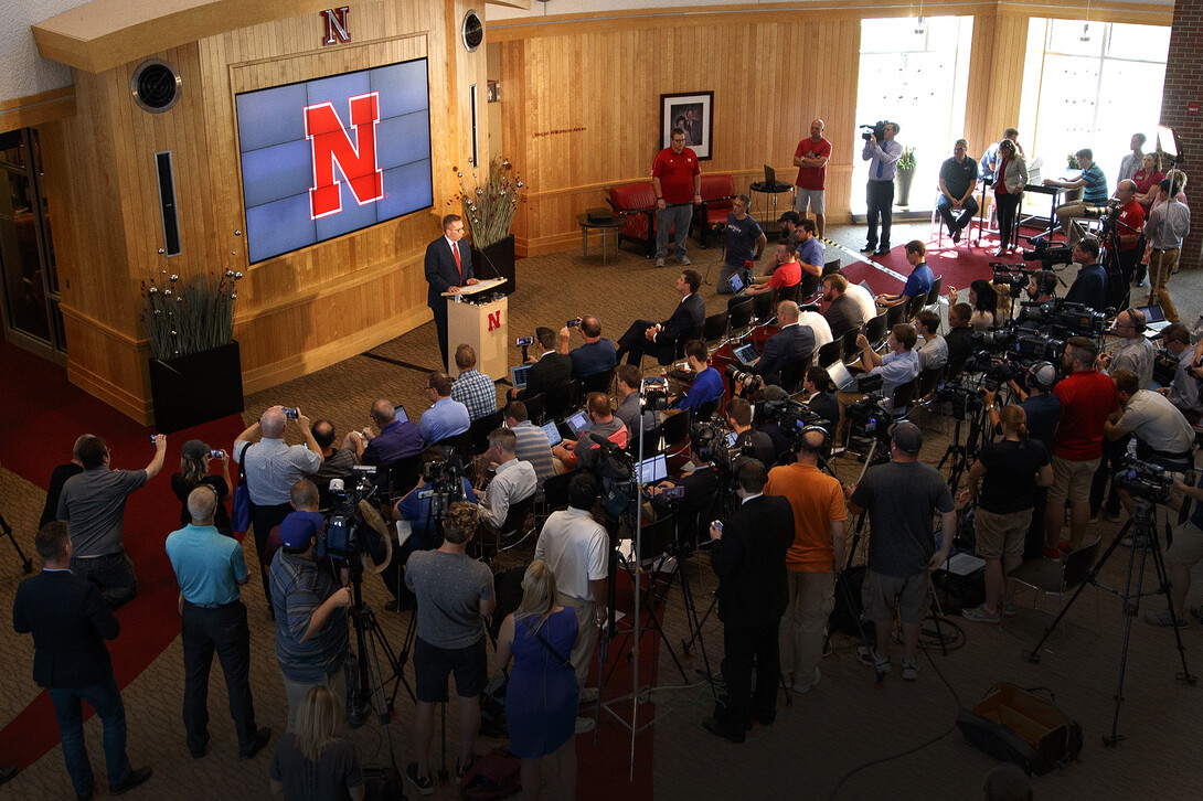 Media and members of the campus community listen to the Sept. 21 press conference announcing the start of a search for a new athletics director.