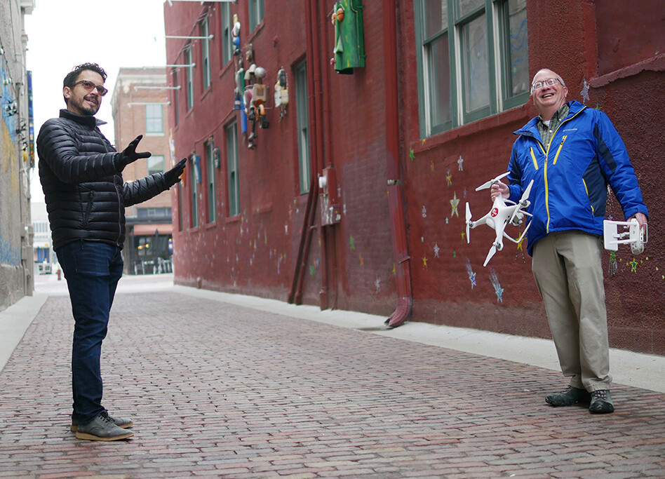 Craig Chandler and Ernesto Sanchez Andrade review the site and discuss needed imagery.