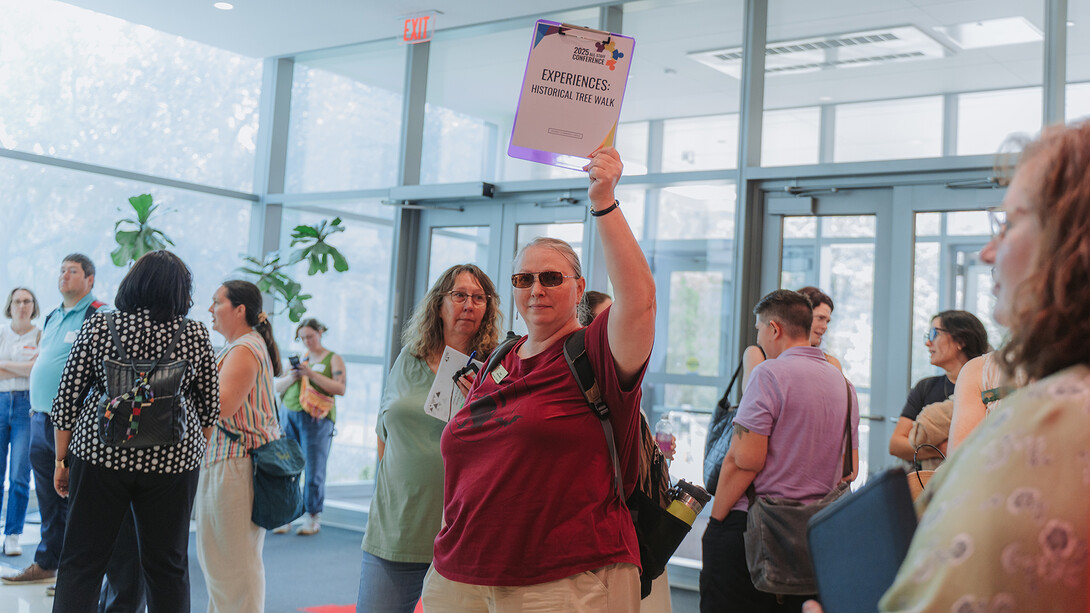 Woman leading a tour during an event.