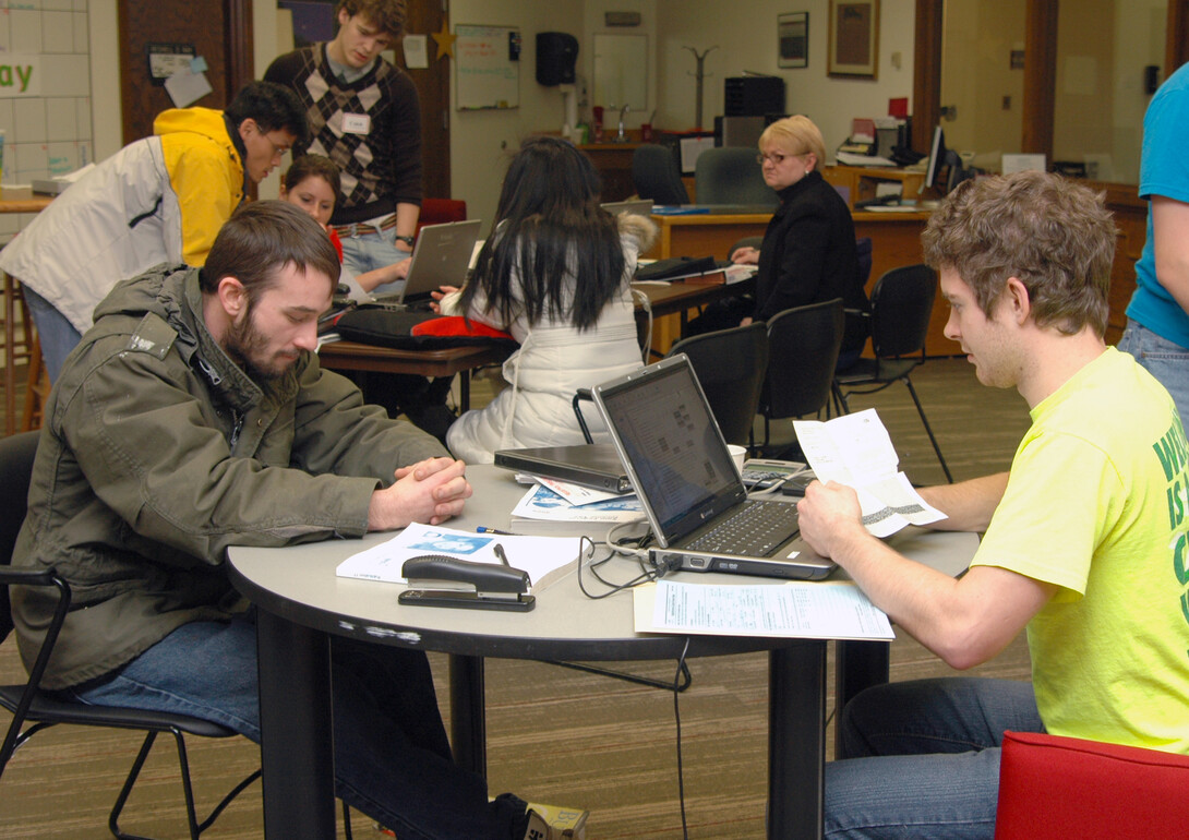 Volunteers assist with federal and state tax form preparation during a session offered at UNL. The university has offered the free service for eight years.