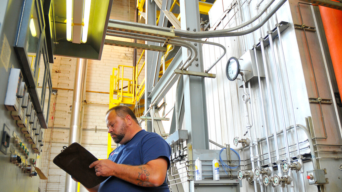 City Campus utility plant worker Scott Zwiener logs boiler data on Nov. 11. Utility plant employees record the data every hour.