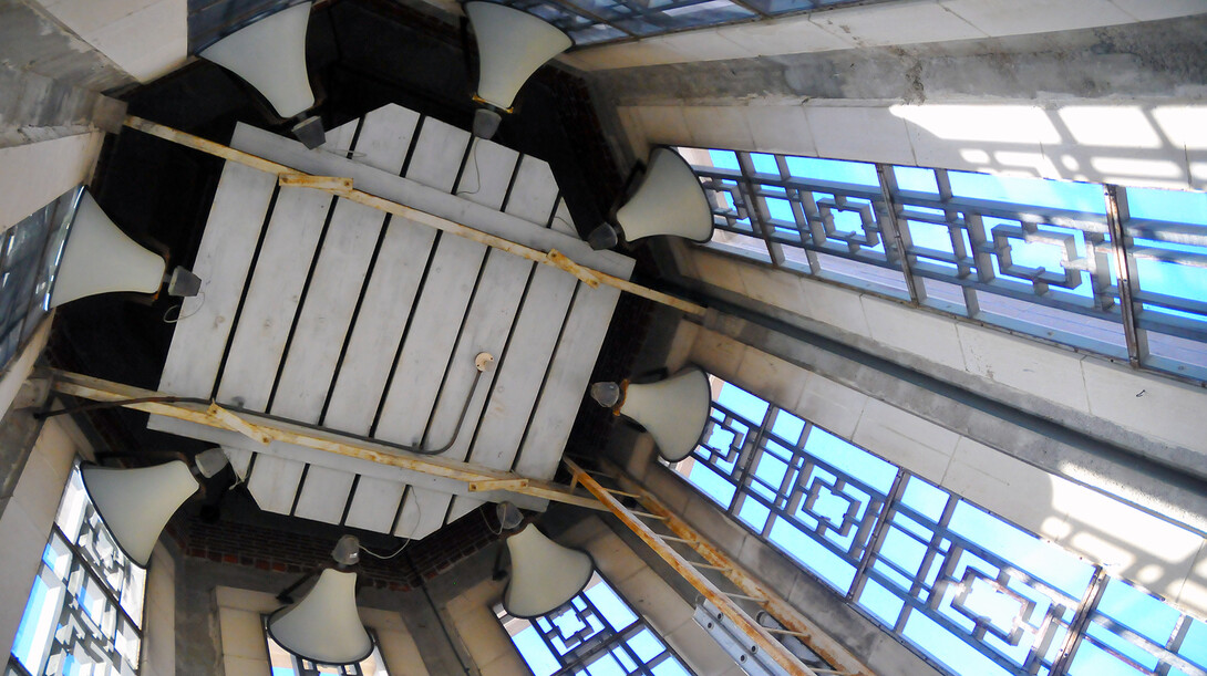 The electronic sound system linked to Mueller Tower plays random songs through eight speakers. The speakers are positioned at the very top of the interior of the tower.