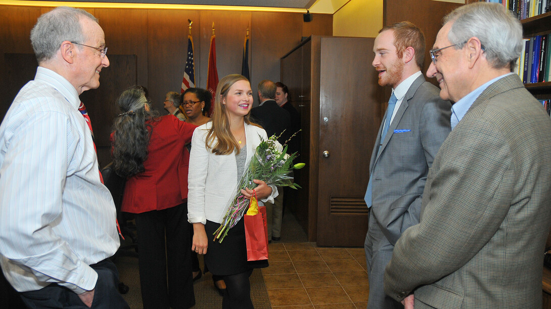 Annie Himes (second from left) talks with (from left) Chancellor Harvey Perlman, Matthew Boring and Patrice Berger, director of the University Honors Program, during a Truman Scholar celebration in Canfield Administration Building on April 9. Himes is one of 60 students nationally to earn the award this year. Boring, marketing and sales manager at the Lied Center for Performing Arts, was named a Truman Scholar in 2010.