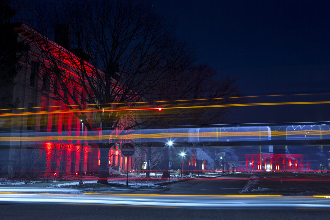 A StarTran bus cruises by Agriculture Hall and the East Campus Mall during the Feb. 14 Glow Big Red event.