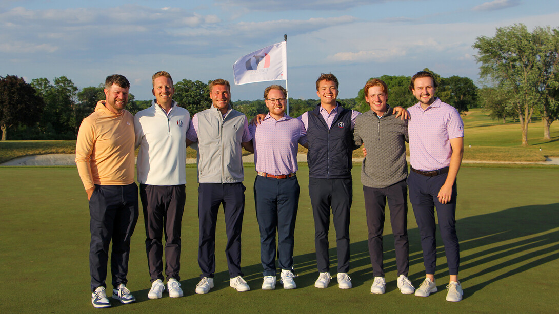 Nebraska's Kolby Head stands with the team at Hazeltine National Golf Club.