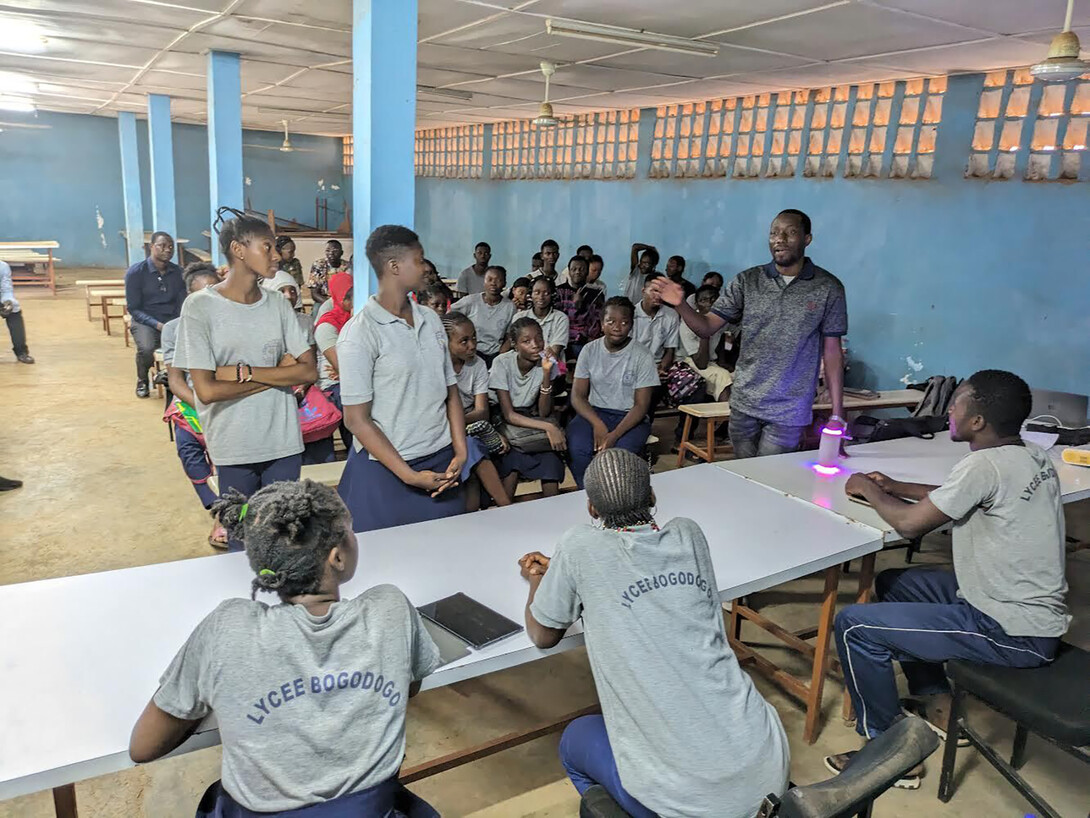 Inoussa Malgoubri, standing at right, doctoral candidate in teaching, learning and teacher education, leads a workshop in Burkina Faso on how to help multilingual learners in the classroom.