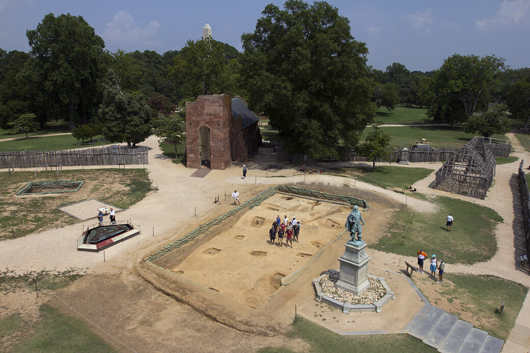 The focus of this summer’s Jamestown Rediscovery archaeological research and field school at Jamestown was the comprehensive excavation of the 1608-1617  church (foreground behind John Smith statue). The work uncovered a rectangular pattern of  postholes 