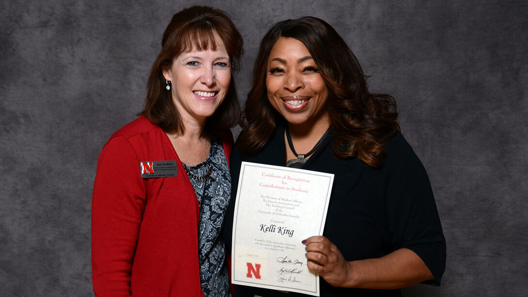 Kelli King (right), director of the William H. Thompson Learning Community, accepts her Parents' Recognition Award from Amy Goodburn, senior associate vice chancellor and dean of undergraduate education, during the Parents' Recognition Awards on Feb. 2. More than 228 faculty and staff were honored for their support of Nebraska students.