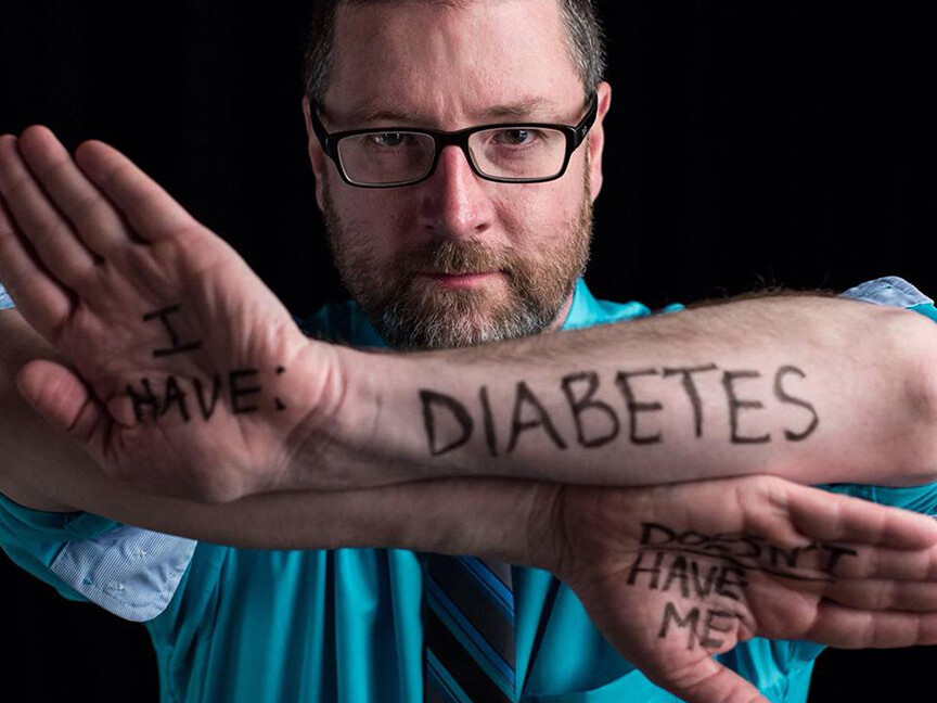 Mike Jackson, assistant director for marketing and communications with Student Involvement, poses for the Dear World project during a conference in New Orleans. The project, which allows people to tell their story through a few words and a photo, will make a stop at UNL on April 7.