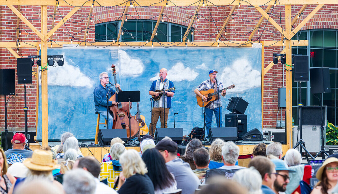 Three performers take the stage for the Nebraska Bluegrass Concert Series.
